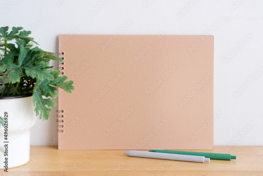Blank notebook paper on wooden table background, mock up, template