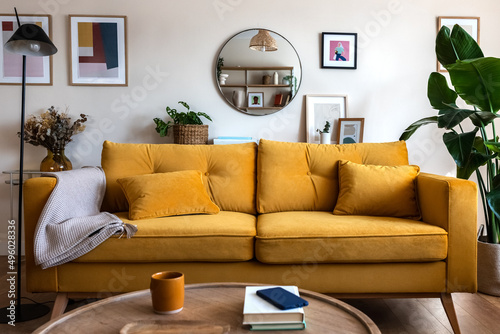 Obraz na płótnie Front view of yellow couch in living room apartment interior.