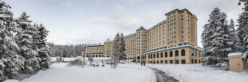 Panoramic view of the Fairmont Chateau Lake Louise in Alberta during winter time. 