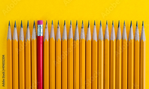 A row of pencils with one different direction