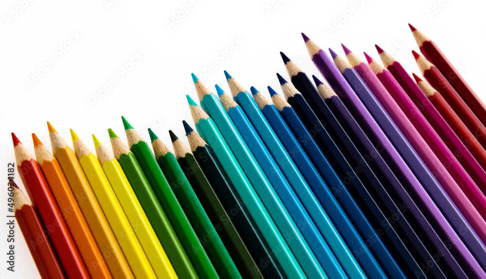 A row of colorful pencils on white background A row of colorful pencils on white background