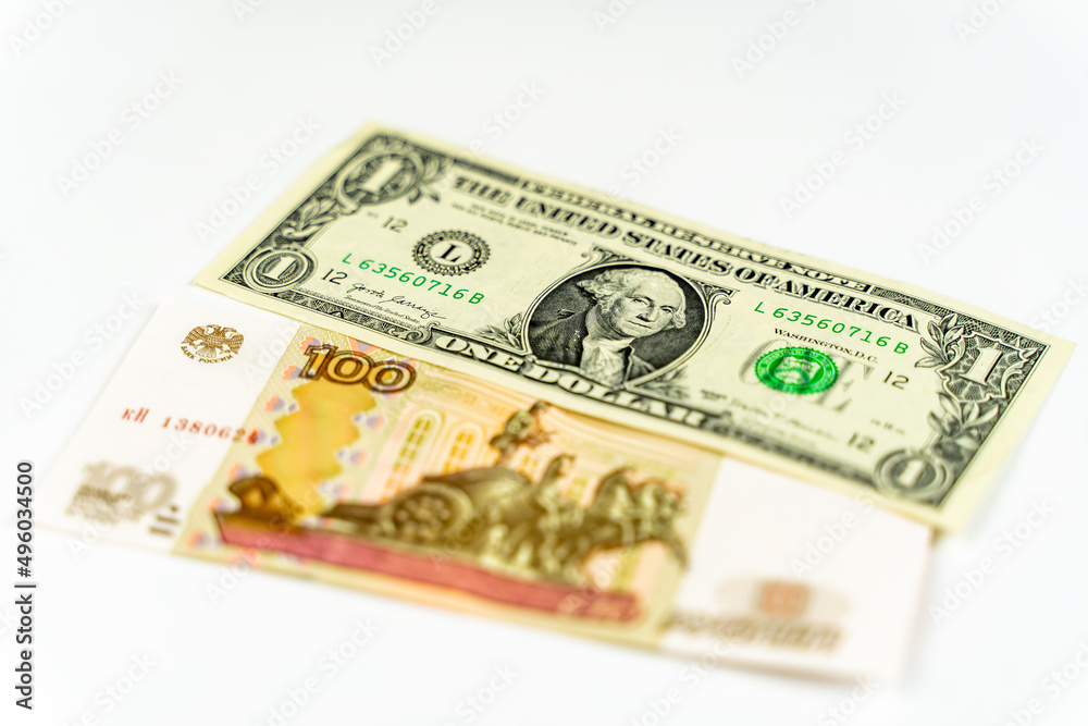 Russian and American paper money. Russian ruble and US dollar exchange rate. Russian and American paper money. Russian ruble and US dollar exchange rate.
