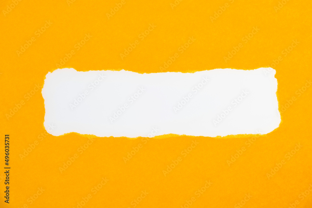 Yellow torn paper on white background