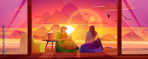Woman rest on house terrace with view to lake and mountains at sunset. Vector cartoon illustration of wooden veranda with chairs, table, and sitting girls with popcorn and blanket at evening