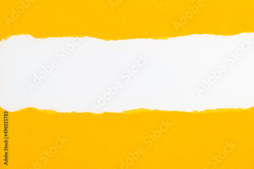 Yellow torn paper on white background