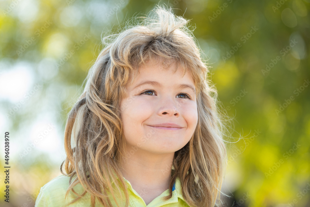 Portrait of adorable little boy on green background park in nature. Wow look. Portrait of amazed cute little boy with curly hair, surprised preschooler. Beautiful child with in summer park outdoors. Portrait of adorable little boy on green background park in nature. Wow look. Portrait of amazed cute little boy with curly hair, surprised preschooler. Beautiful child with in summer park outdoors.