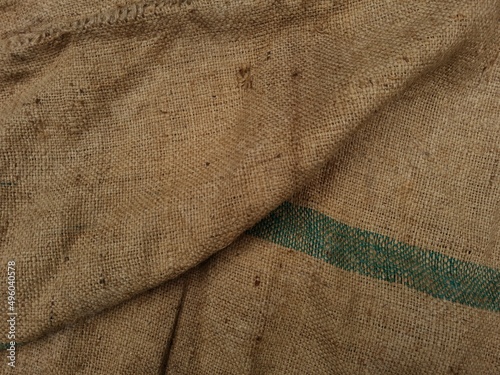 Brown sack background with green lines