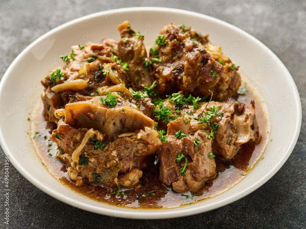 Oxtail. Traditional dish of Brazilian cuisine. Braised sweet soy sauce oxtail Oxtail. Traditional dish of Brazilian cuisine. Braised sweet soy sauce oxtail