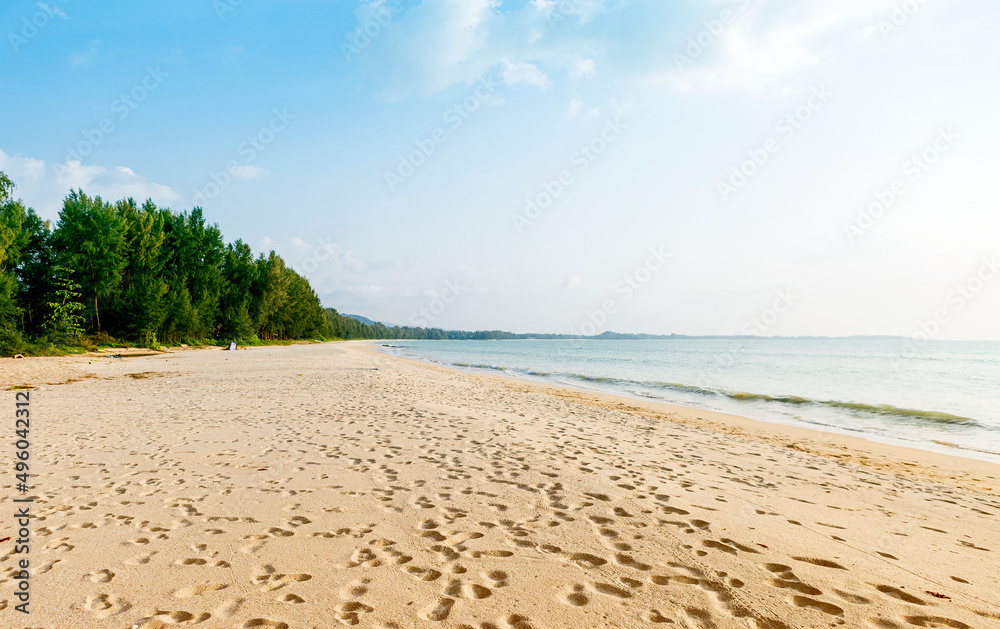 Foot step on empty sandy beach, tropical island, relaxing by the beach