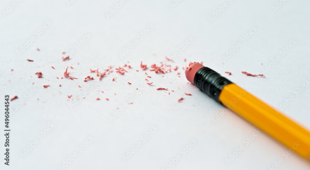 Foto Pencil eraser erasing on white background