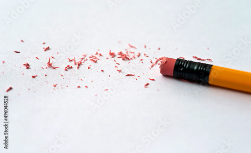 Pencil eraser erasing on white background