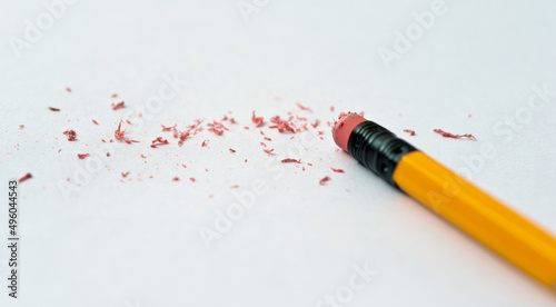 Pencil eraser erasing on white background photo
