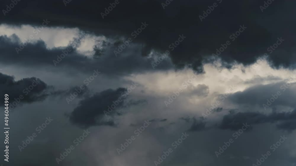 background of dark dramatic sky with stormy clouds timelapse before rain or snow, extreme weather
background of dark dramatic sky with stormy clouds timelapse before rain or snow, extreme weather