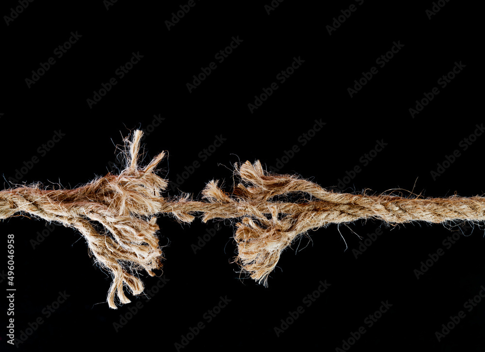 Obraz na plátně Broken rope on black background