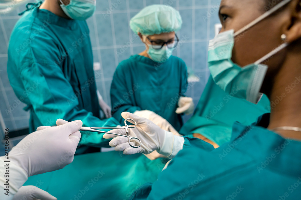 Team of surgeon at work in operating room. Healthcare, hospital concept Team of surgeon at work in operating room. Healthcare, hospital concept