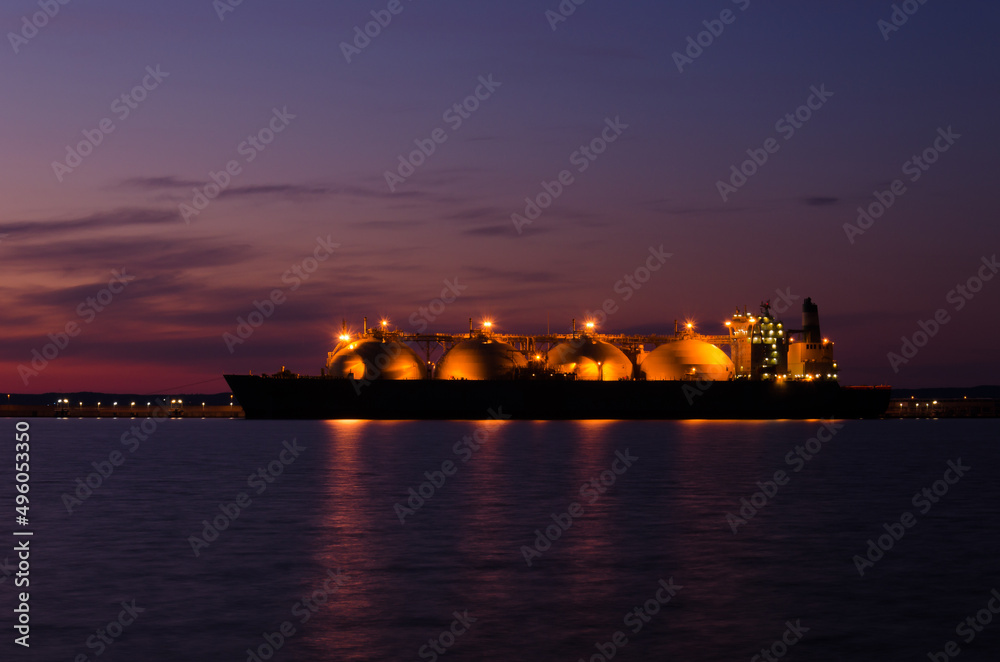 LNG TANKER - Ship at the gas terminal with sunrise