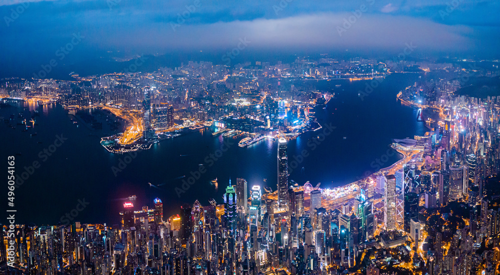 Fototapeta premium Amazing night aerial view of cityscape of Victoria Harbour, center of Hong Kong