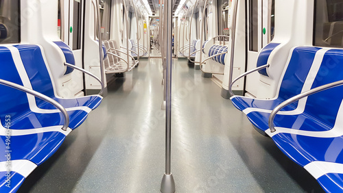 Subway empty car design with plastic blue seats in Barcelona, Spain