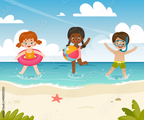 Cute kids playing on the sea coast. Adorable summertime children jumping on the beach.