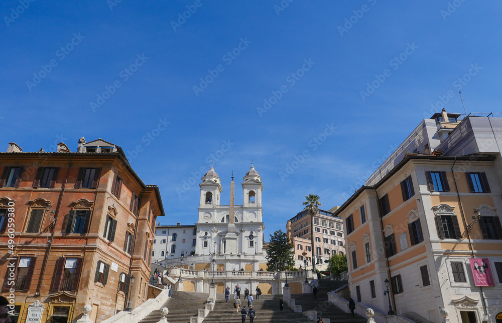 Spanish Steps and a boat-shaped fountain on Piazza di Spagna in Rome, Italy. Early morning panoramic shot after rain. High quality photo
