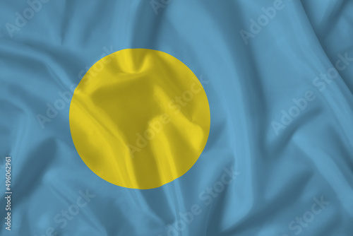 Palau flag with fabric texture. Close up shot, background