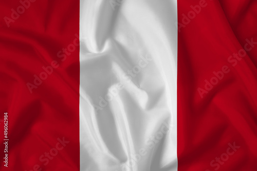 Peru flag with fabric texture. Close up shot, background