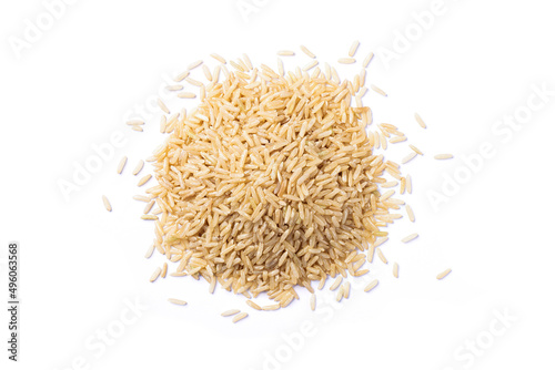 Pile of coarse brown rice isolated on white background. Top view. Flat lay.