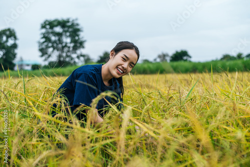 Portrait young female farmer in rice field © Johnstocker