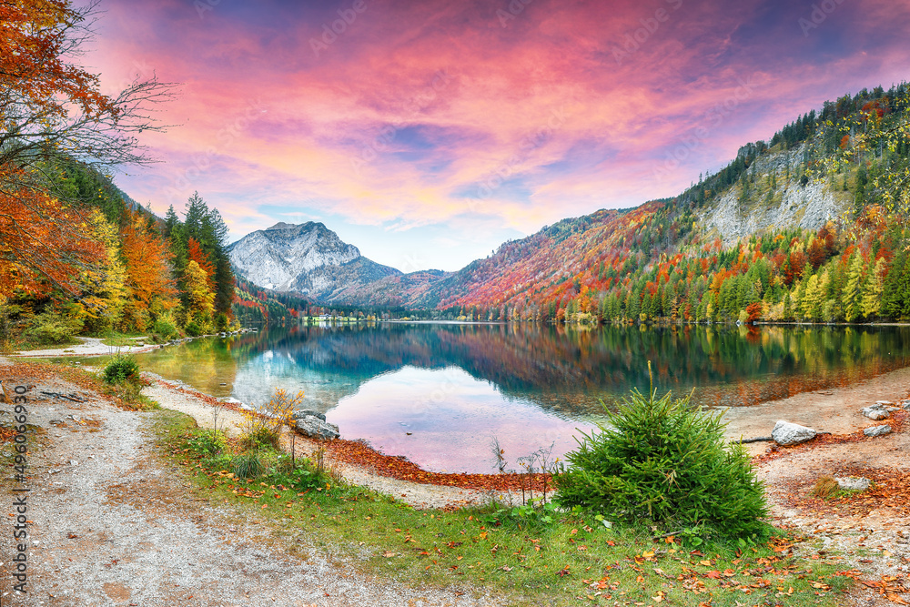 Stunning autumn scene of Vorderer Langbathsee lake.