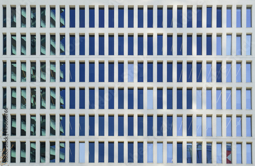 full frame shot of the symmetrical facade of an office building