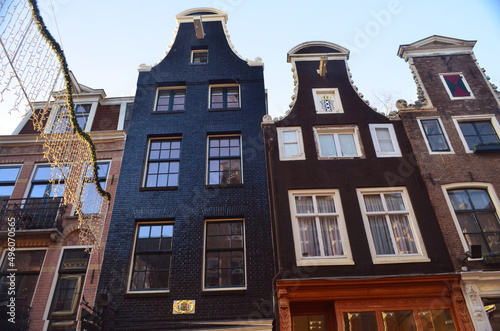 Photography houses in amsterdam in spring on a sunny day view from the bridge