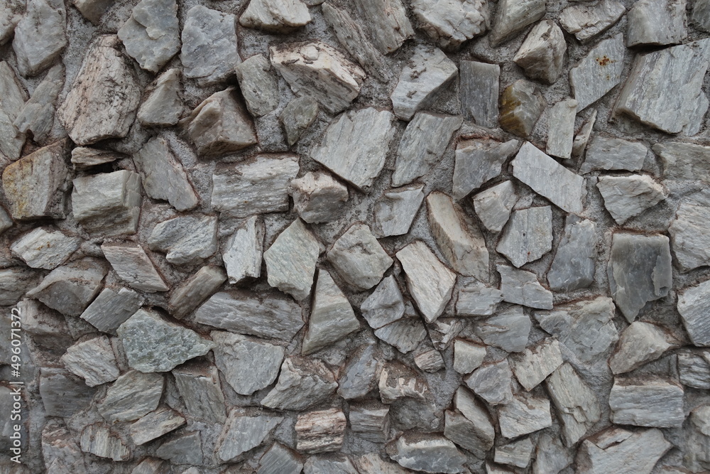 Texture of whitish gray gravel pebble dash on the wall Texture of whitish gray gravel pebble dash on the wall