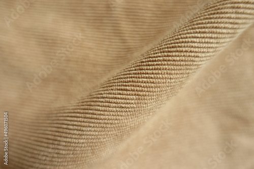 Diagonal fold on light brown corduroy fabric