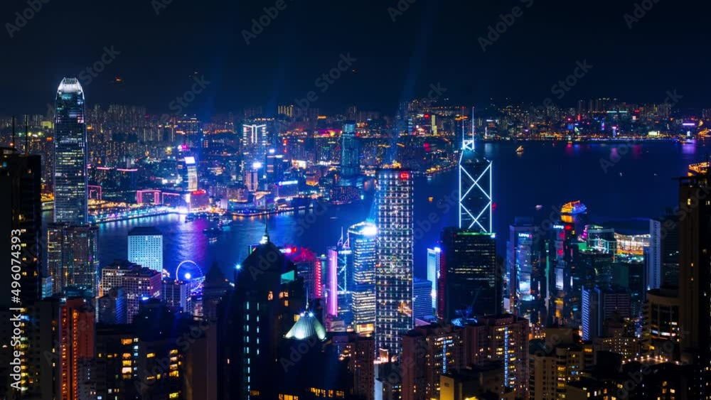 Hong Kong at night. Skyline of Hong Kong at night. Illuminated skyscrapers with dark sky and river. Time-lapse from evening to night, panning video Hong Kong at night. Skyline of Hong Kong at night. Illuminated skyscrapers with dark sky and river. Time-lapse from evening to night, panning video