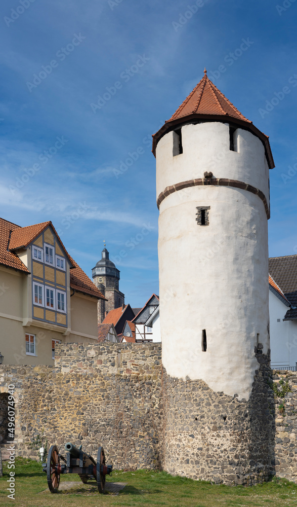 Old watchtower with historic cannon in front of the old city wall of Homberg Efze in Germany