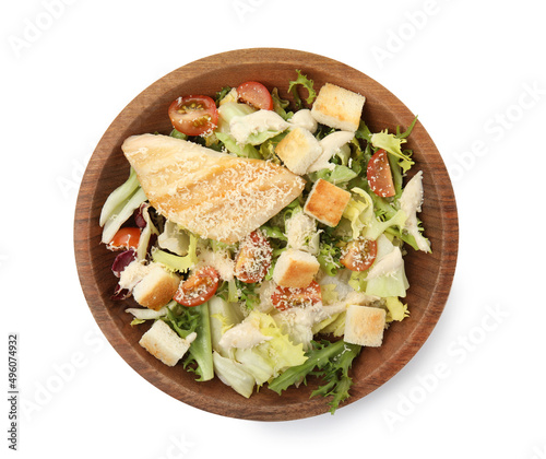 Delicious Caesar salad in bowl isolated on white, top view