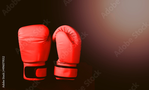 Boxing adhesive gloves on black background © vachcameraman