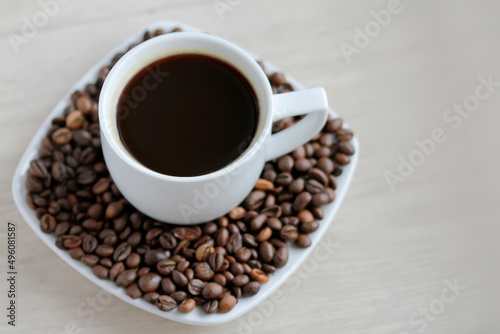 Coffee cup with coffee beans close up