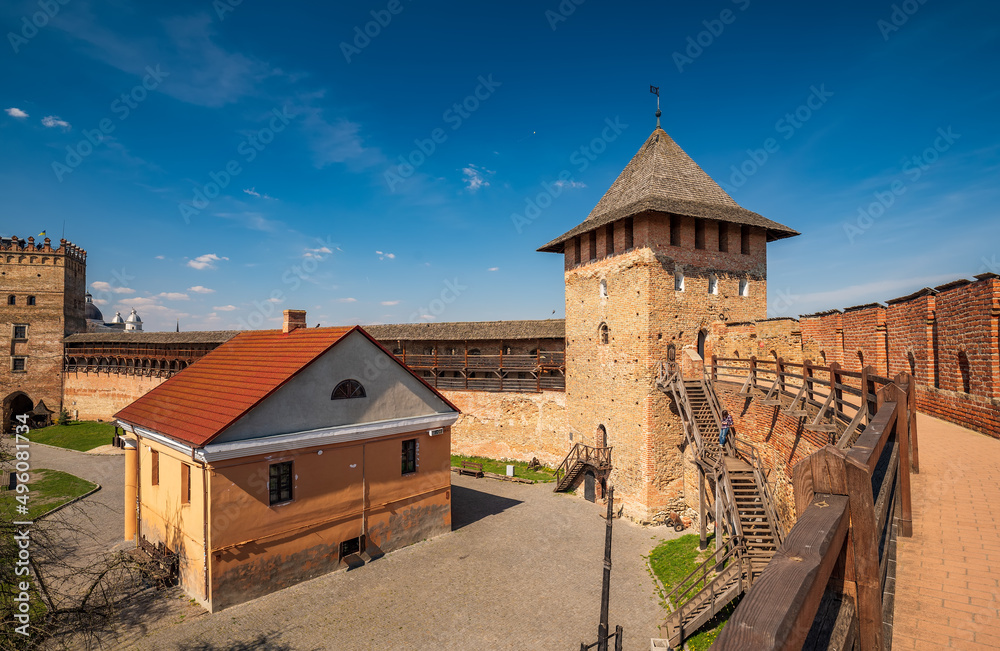 Scenic view of Lubart's Castle with walls, wooden stairs, Bishop's Tower and Bishop's Palace, Lutsk, Ukraine