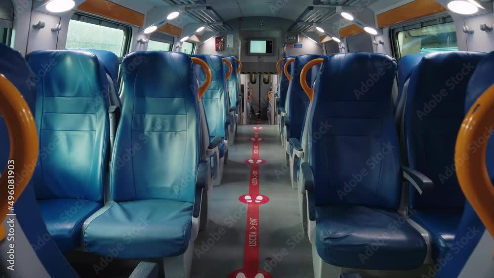 interior of a train wagon with empty seats 