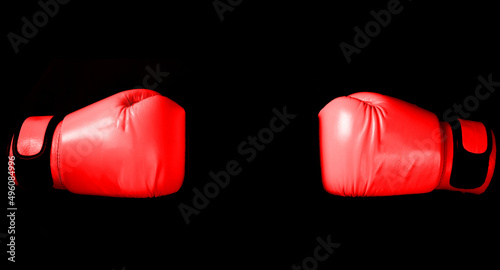 Blue Boxing glove in punching  in black background with copy space © vachcameraman