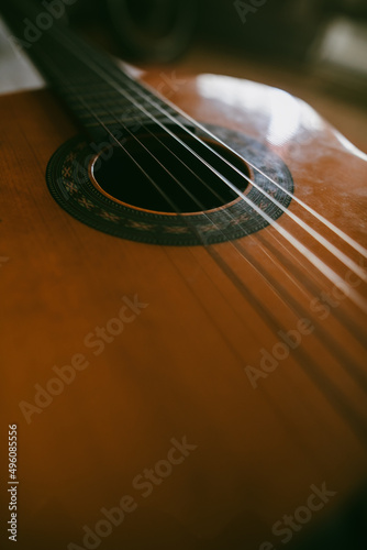 Wooden classical guitar, with plastic strings