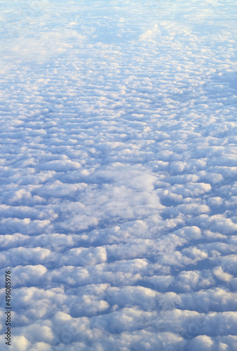 Incredible sea of clouds view from the plane window during flight
