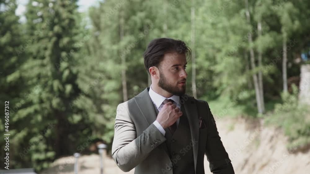 High fashion look.Young stylish confident happy handsome businessman model in suit cloth lifestyle in the street High fashion look.Young stylish confident happy handsome businessman model in suit cloth lifestyle in the street