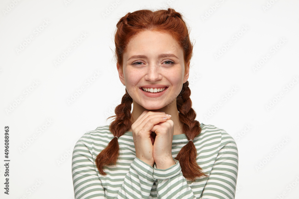 smiling ginger young female starring into camera smiling ginger young female starring into camera