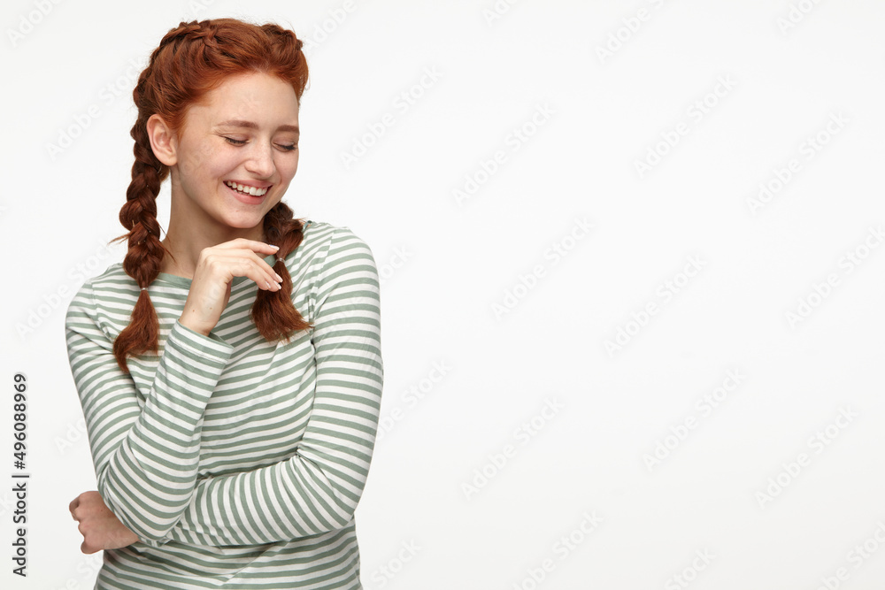 ginger young female smiling and looks aside ginger young female smiling and looks aside