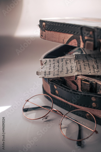 A romantic note, a message before a long journey or travel sketches, memoirs, with a suitcase, a glasses  in a retro style