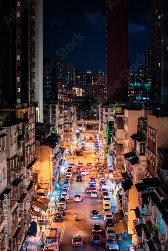 Photography Kowloon City: Night of busy street, many people and cars, downtown of Kowloon Ci