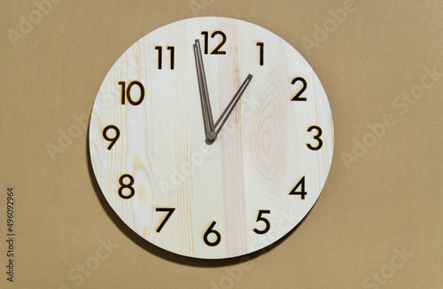 Retro wall clock on wooden background