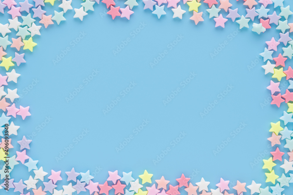 The stars in various colors on the blue background